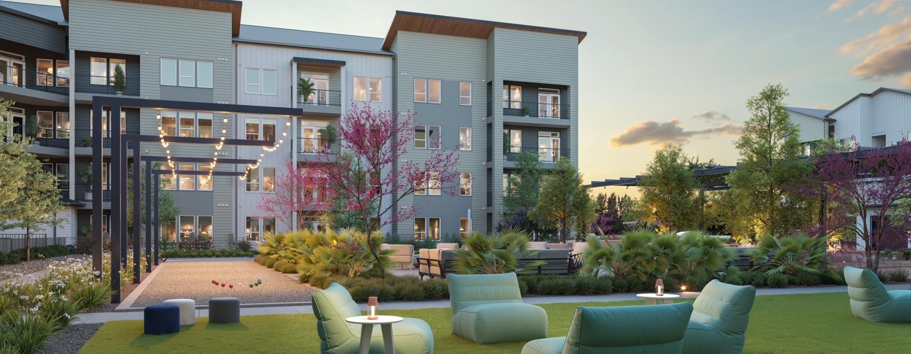 a building with a lawn and chairs