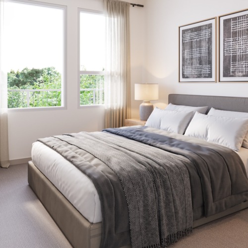 a bedroom with a bed and two nightstands