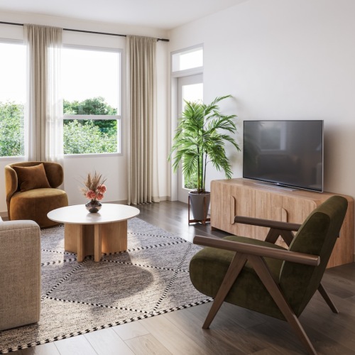 a living room with a tv, couch and chairs