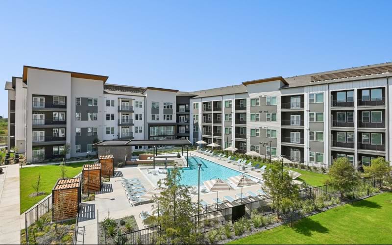 a swimming pool surrounded by apartment buildings