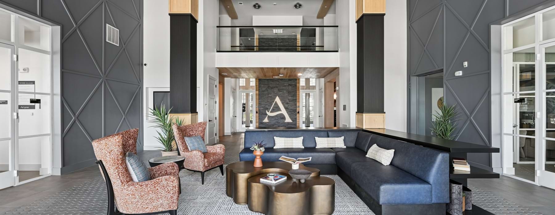 a waiting area with couches and chairs 