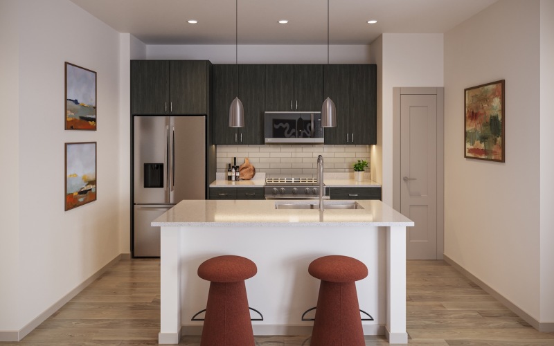 a kitchen with an island and chairs